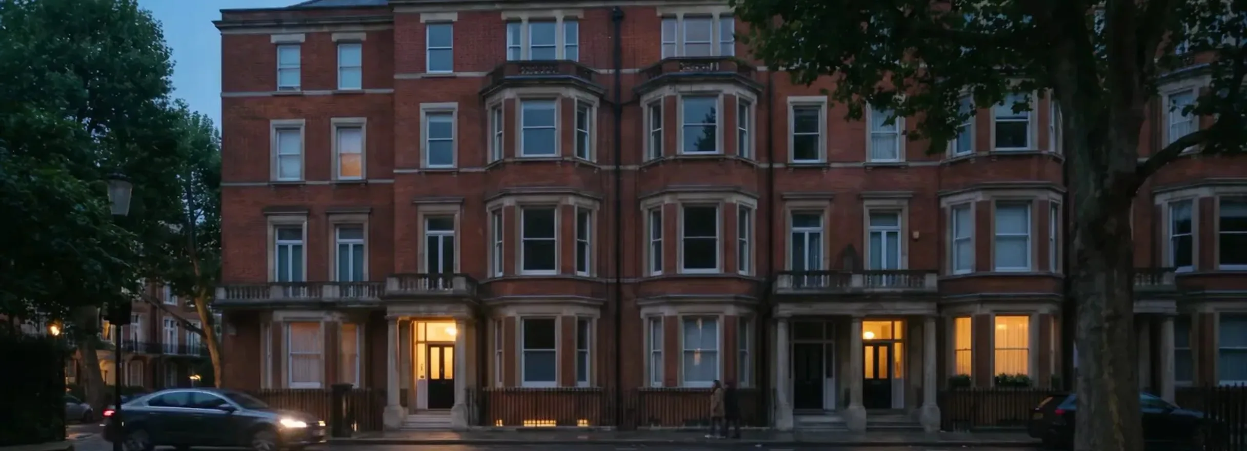 A London terrace at dusk with the windows lit